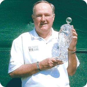 Allen Doyle holding the Hoag Classic trophy