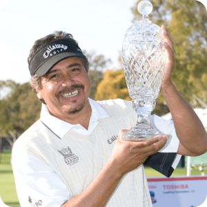 Eduardo Romero holding the Hoag Classic trophy