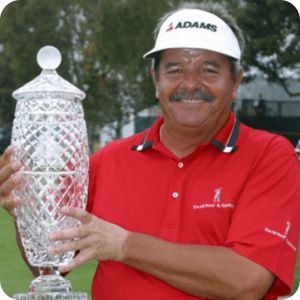 Roger Davis holding the Hoag Classic trophy