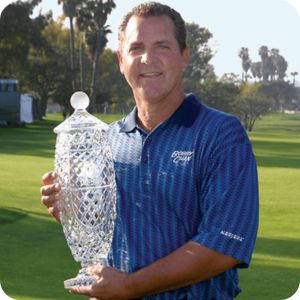 Tom Purtzer holding the Hoag Classic trophy
